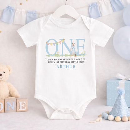 Close-up of personalised blue duck design and custom name print on soft cotton sleepwear.