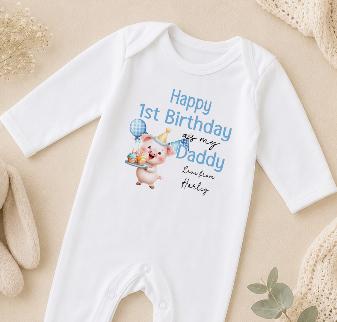 A white onesie with a cartoon pig and text that says "Happy 1st Birthday as my Daddy Love from Harley"