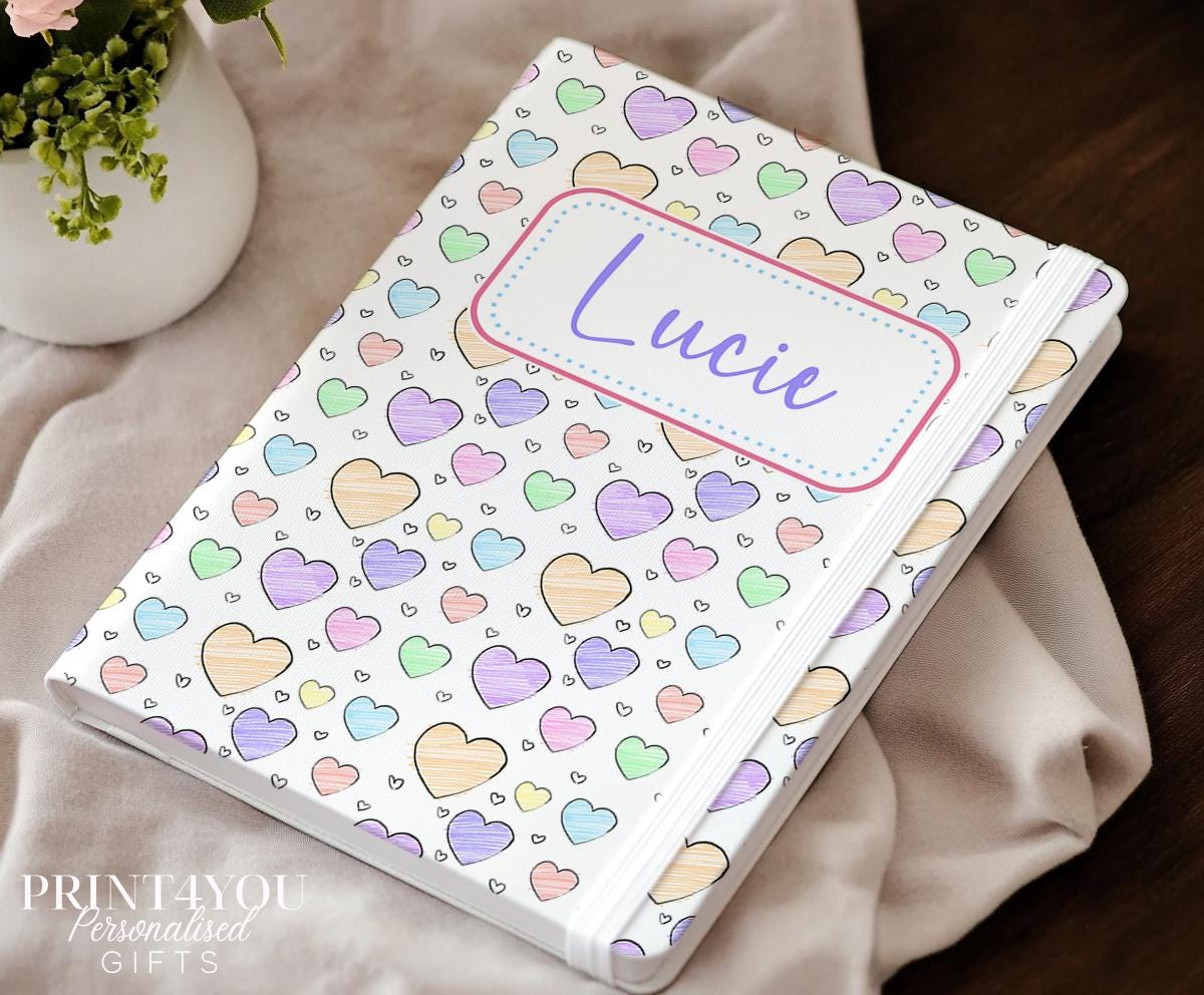 Personalised A5 heart notebook with pastel rainbow hearts and custom name on cream PU leather cover