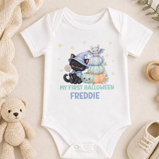 Personalised baby’s first Halloween outfit with a cute black kitten, pastel pumpkins, bat and child’s name in blue and teal.