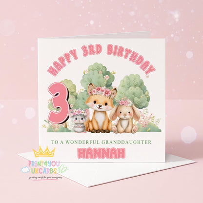 Personalised birthday card showing a woodland scene with a bunny and fox wearing floral crowns, with space for a custom name and age