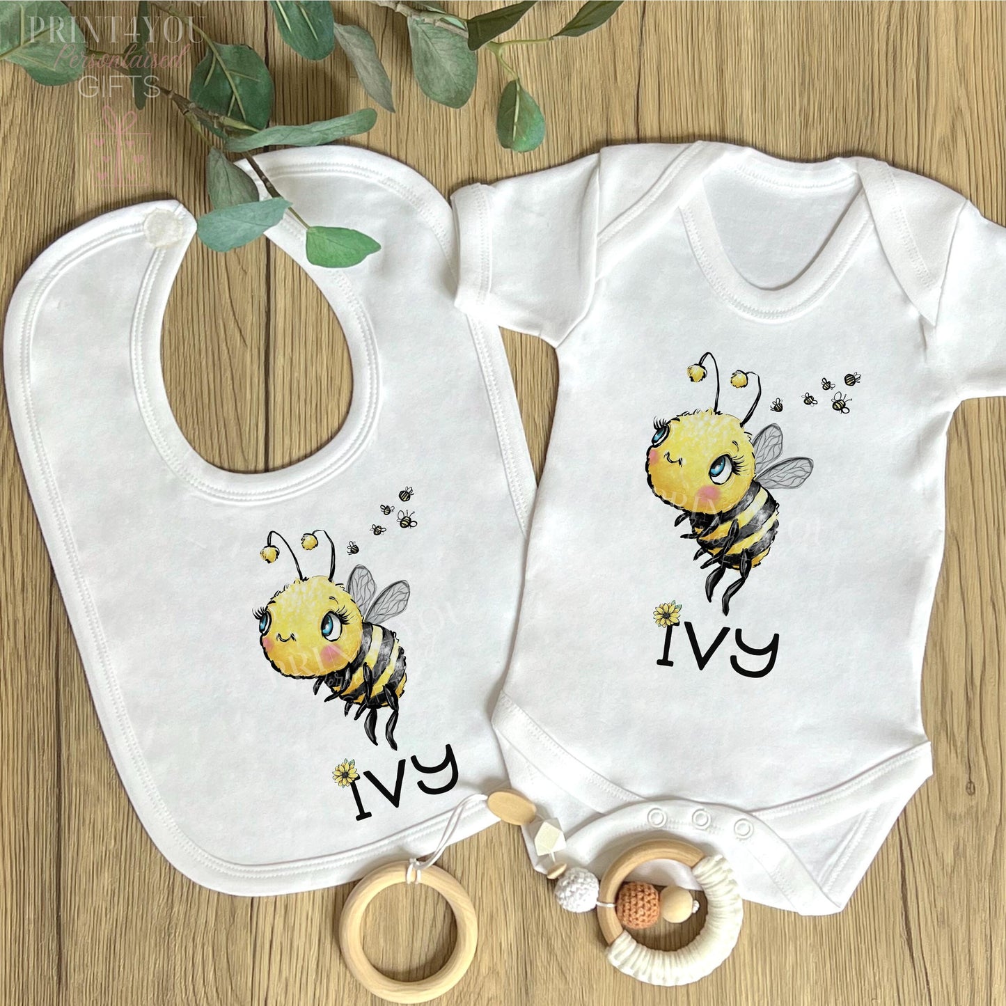 Close-up of the bumble bee design and personalised name on the vest