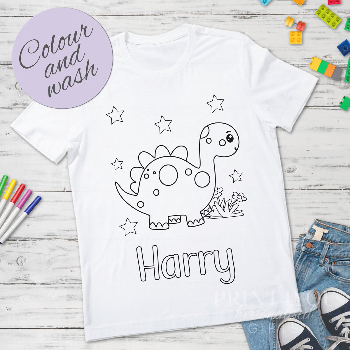 Personalised dinosaur colour-in t-shirt for kids, size 1-2 years, shown with washable pens