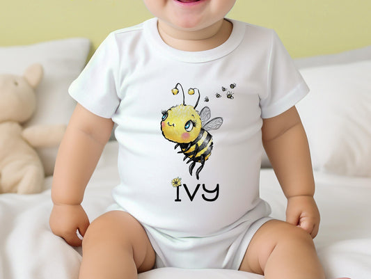 Personalised bumble bee bib printed with baby's name on soft white cotton.