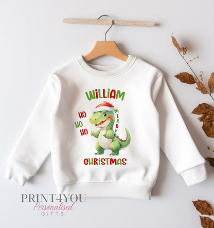 White Christmas jumper with festive dinosaur print and personalised name, size 6-12 months