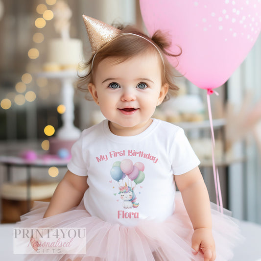 Personalised unicorn balloons first birthday bib, printed on soft cotton with space for your baby's name.