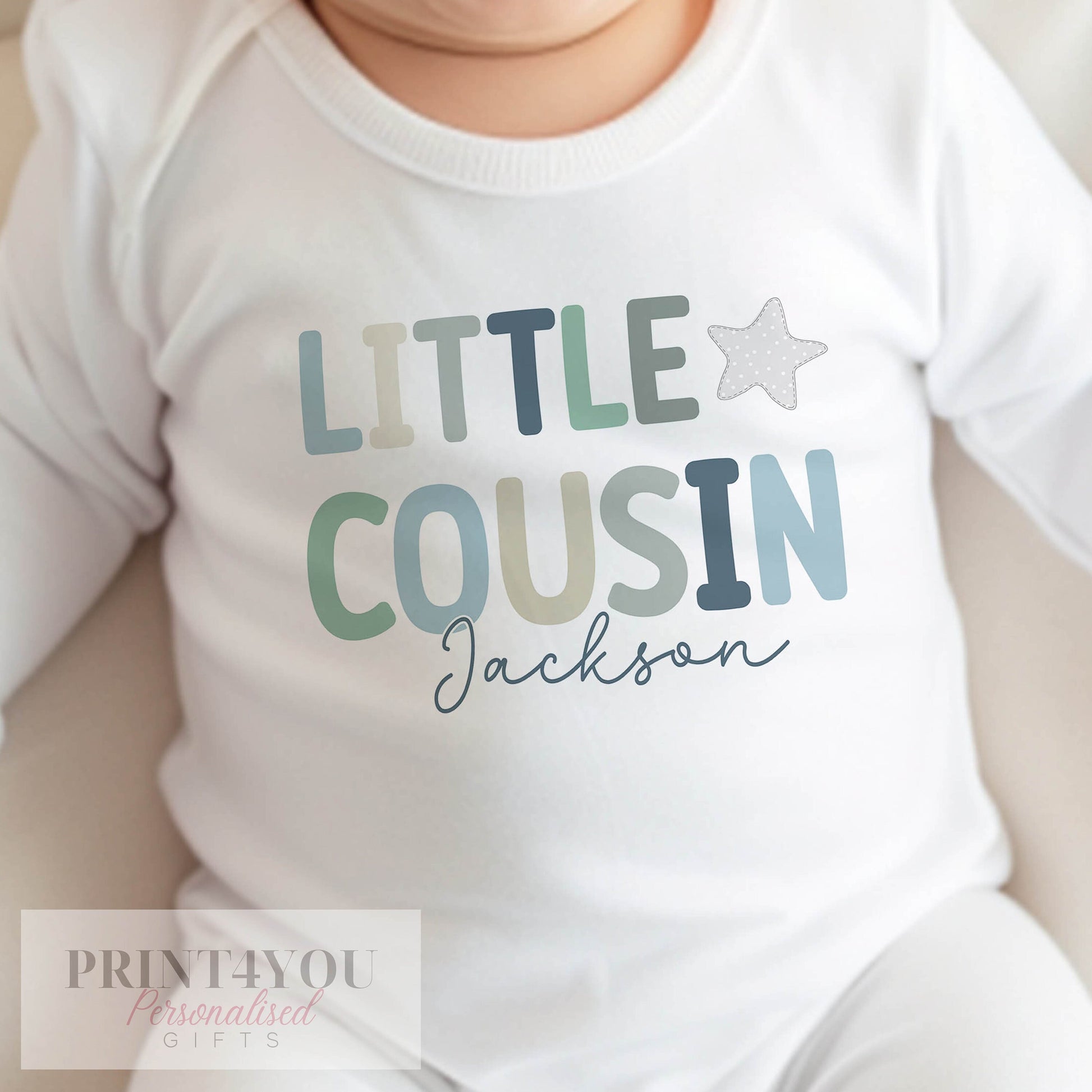 Personalised little cousin bib with baby's name printed on soft cotton.