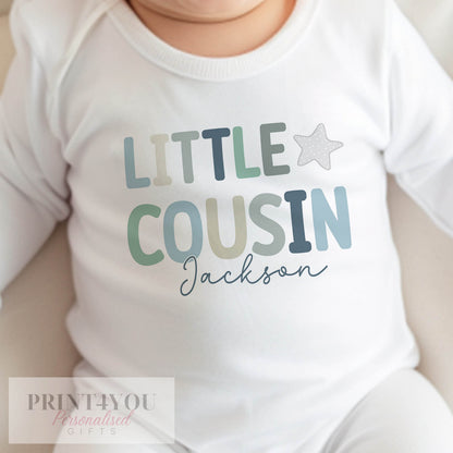 Personalised little cousin bib with baby's name printed on soft cotton.