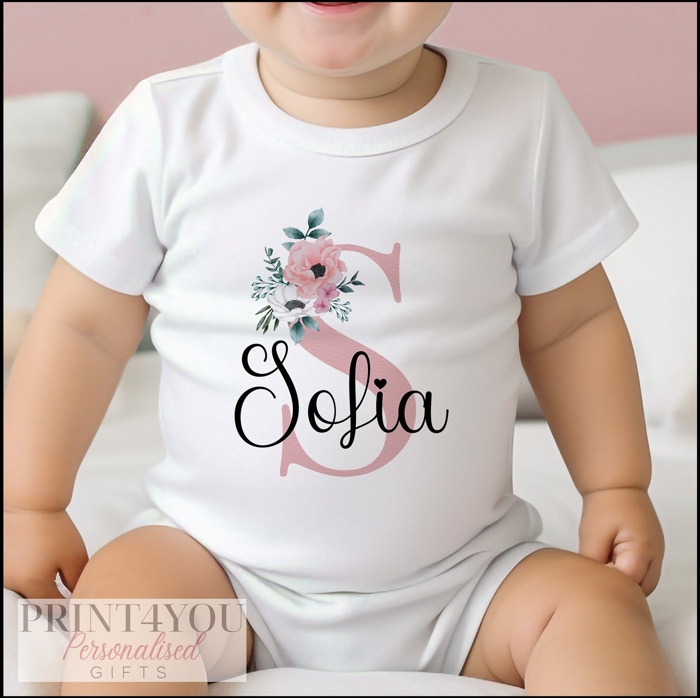 Personalised Baby Girl Sleepsuit in soft white cotton with pink floral name design
