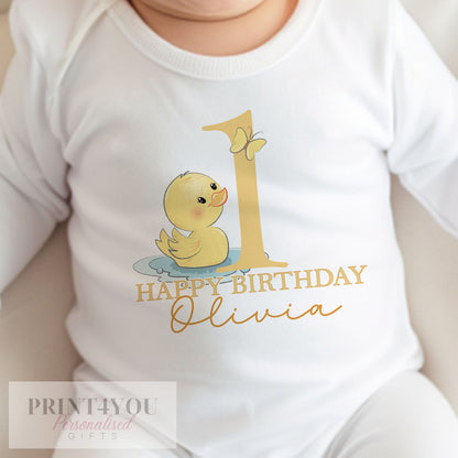 Personalised rubber duck first birthday bib in soft white cotton printed with baby's name