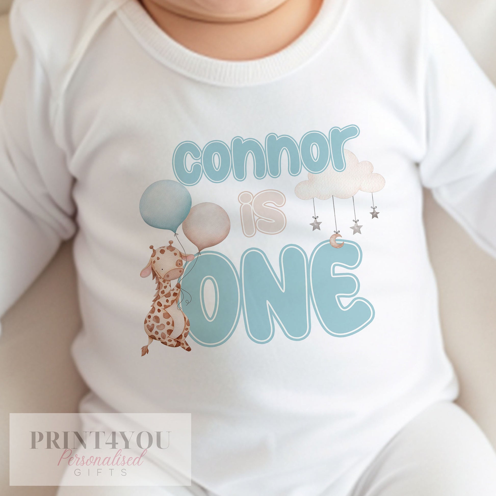 Personalised blue giraffe bib with baby's name printed on soft white cotton.