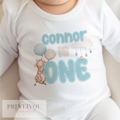 Personalised blue giraffe bib with baby's name printed on soft white cotton.