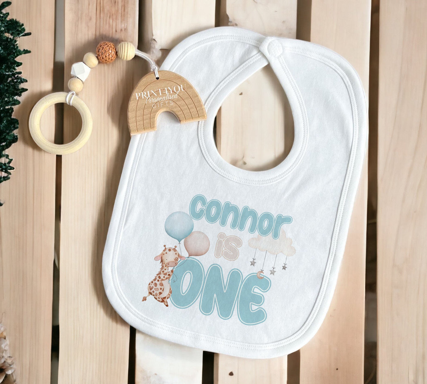 Full range of personalised blue giraffe first birthday garments available to choose from.