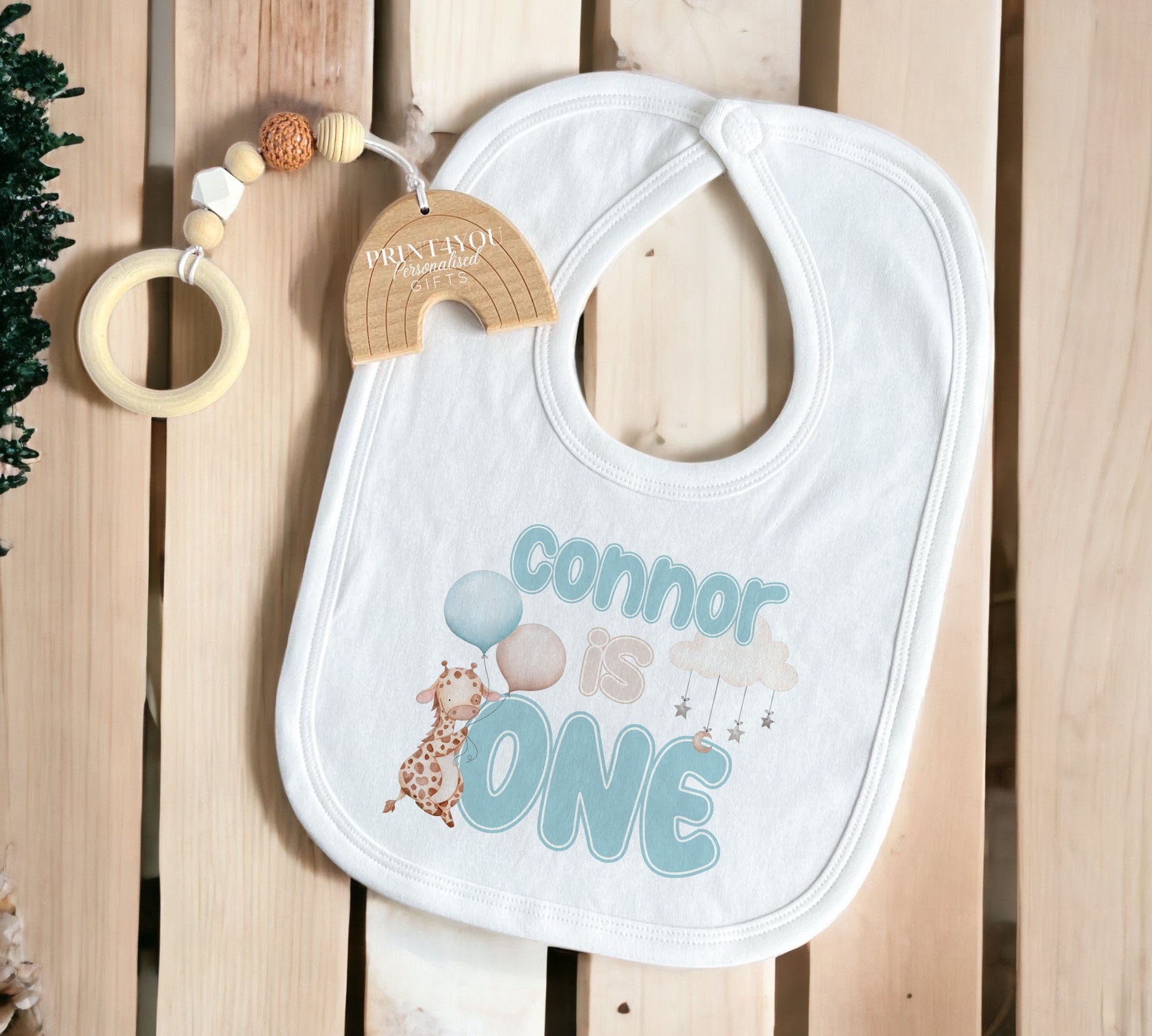 Full range of personalised blue giraffe first birthday garments available to choose from.