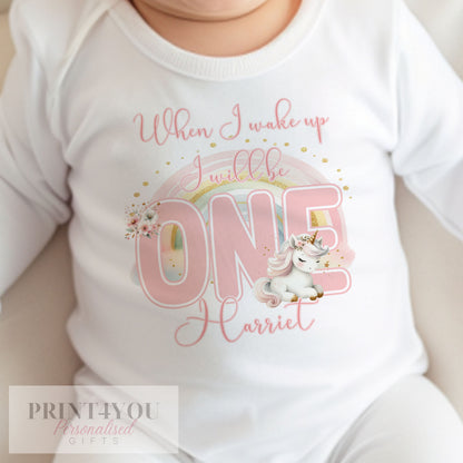 Personalised unicorn and rainbow first birthday bib in soft white cotton, printed with 'When I Wake Up I Will Be One'.