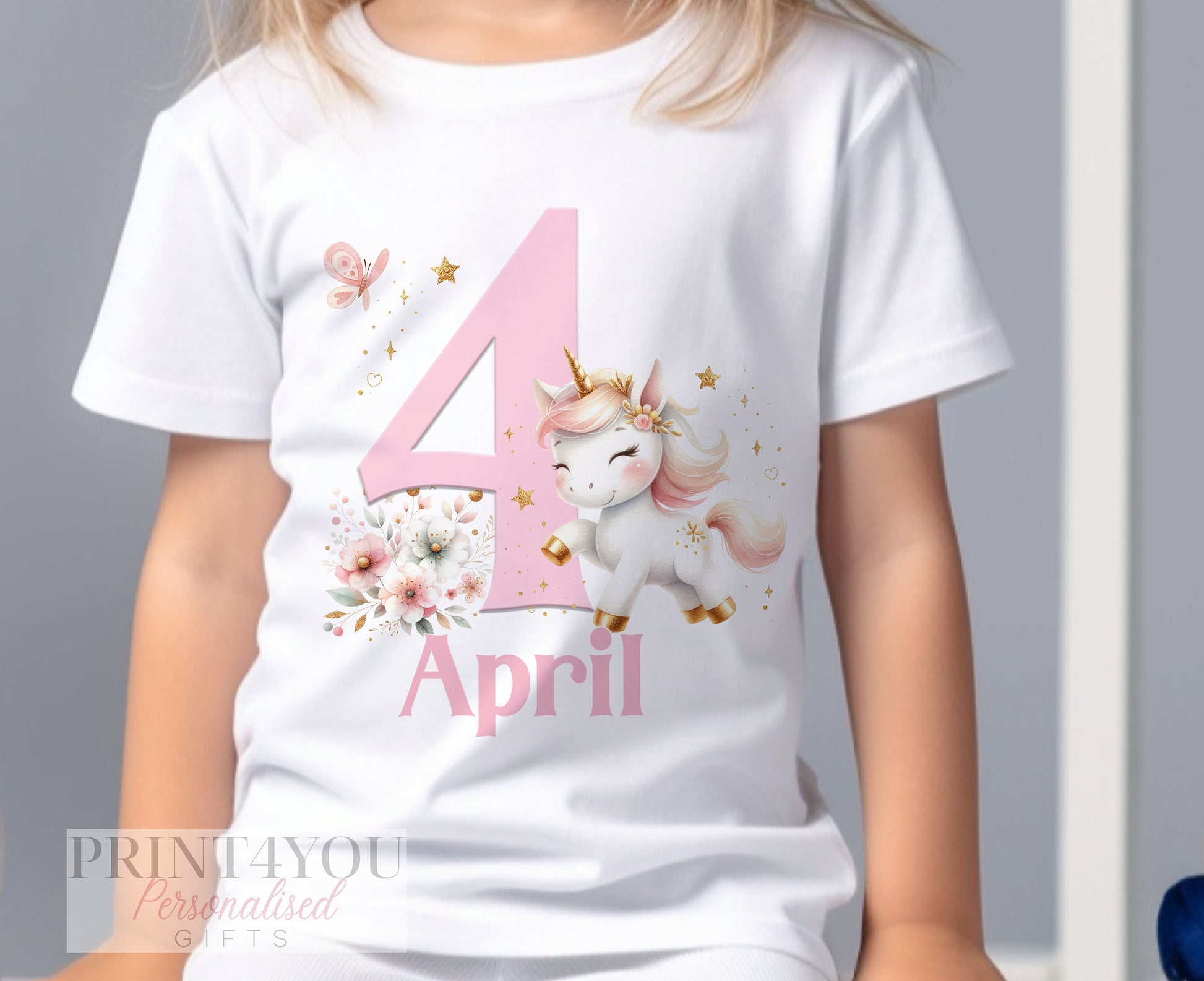 Close-up of the sparkly unicorn birthday t-shirt print showing the design and personalisation detail.