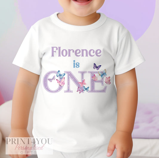 Personalised butterfly first birthday bib with delicate butterfly artwork and the baby's name.