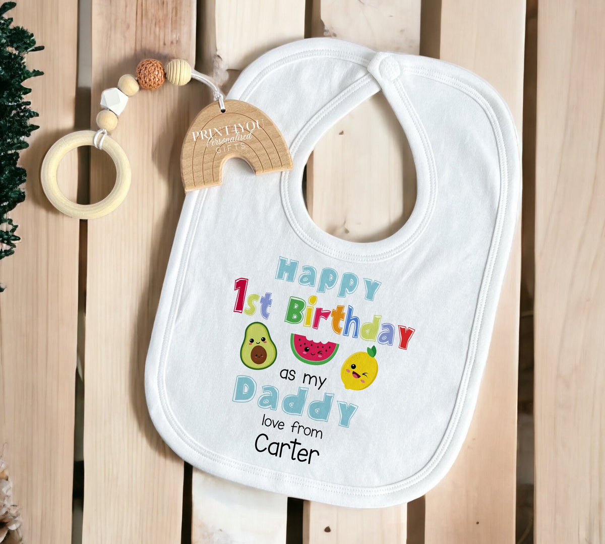 Personalised dancing fruit sleepsuit featuring the kawaii fruit design with the baby's name.