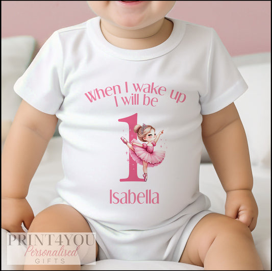 Personalised ballerina first birthday bib with a twirling ballerina design and the baby's name.