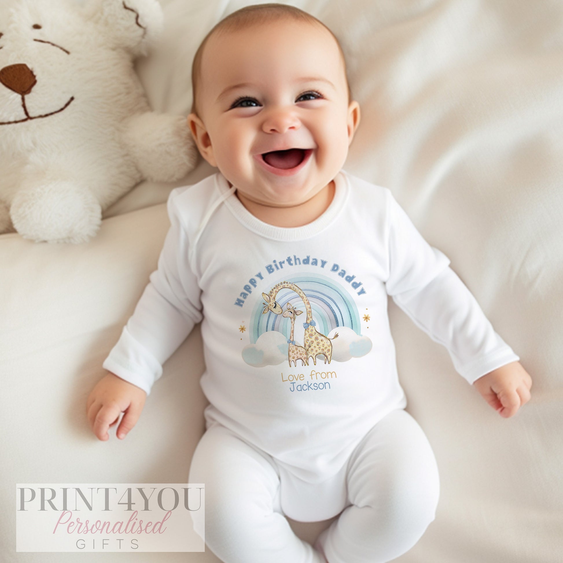 Personalised rainbow giraffe t-shirt printed with the giraffe and rainbow design and the baby's name.