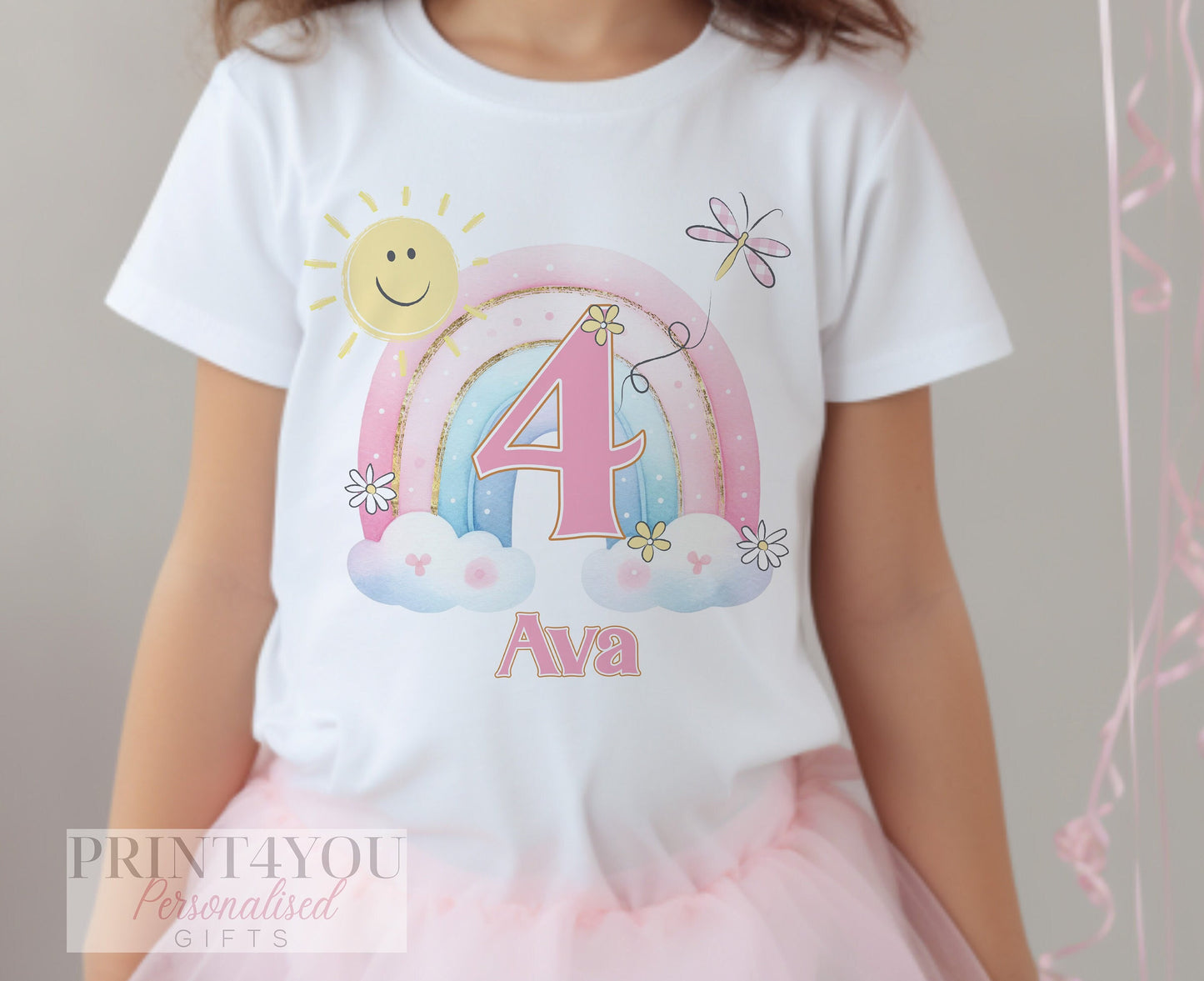 Personalised rainbow birthday t-shirt printed with a child's name and age number.