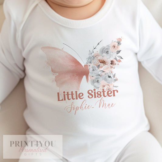 Personalised butterfly bib for a new baby sister, printed with a custom name.