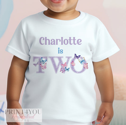 Personalised purple butterfly birthday t-shirt for a girl's second birthday, age 1-2 years, printed with a custom name.