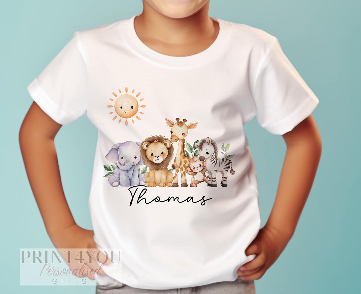 Personalised safari animal birthday t-shirt in white cotton, baby size 6-12 months, printed with jungle animal graphics and custom name