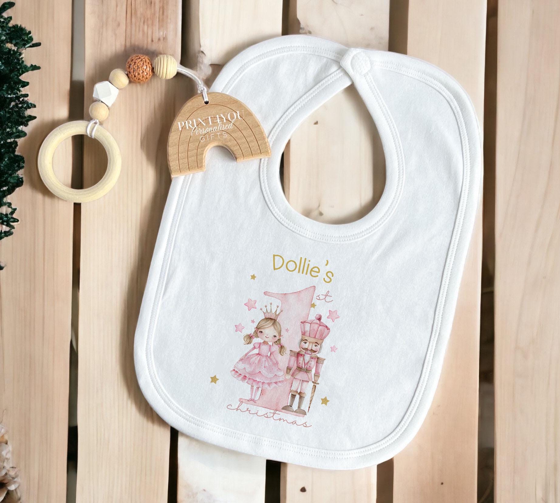 Personalised Pink Nutcracker bib for a baby's first Christmas.