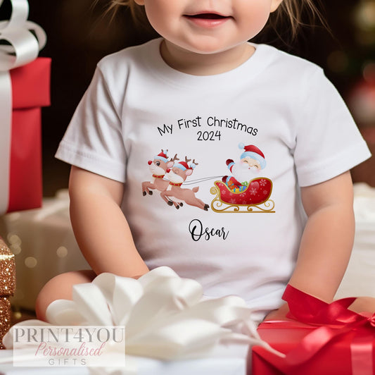 Personalised Santa and Reindeer Sleigh baby's first Christmas bib, vest and sleepsuit set, folded flat.