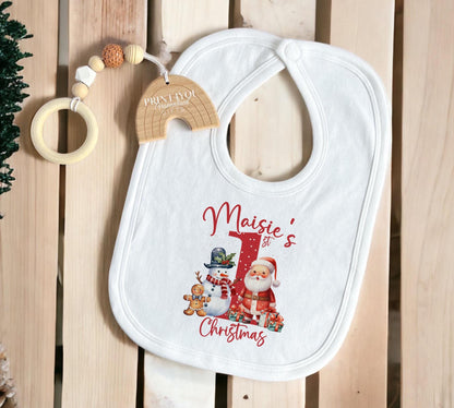 Personalised Santa and Snowman baby sleepsuit laid flat, showing the festive print.