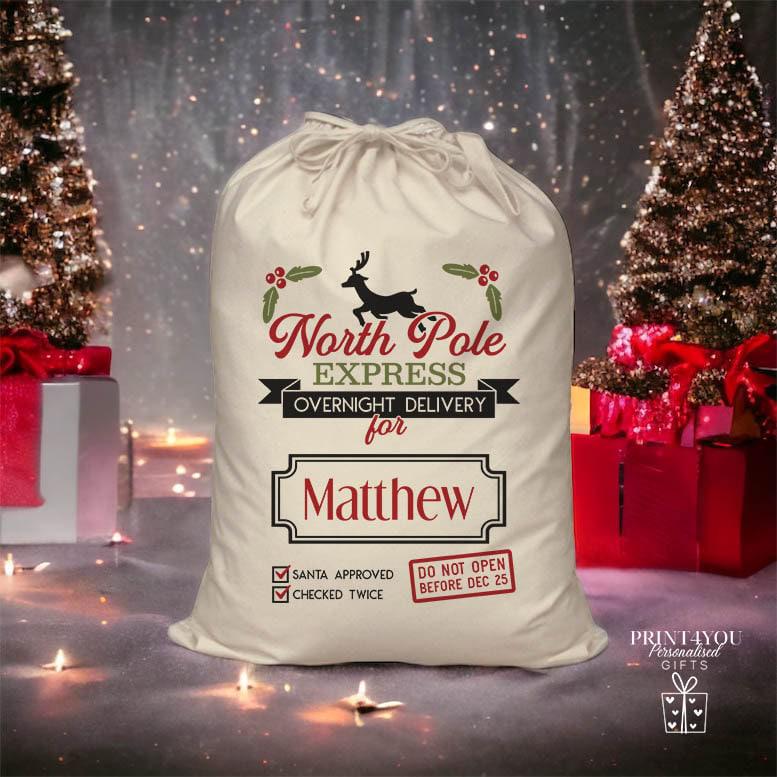 Natural cotton personalised Christmas Santa sack with drawstring closure, printed with a custom name and festive design, ready for Christmas Eve gifts.