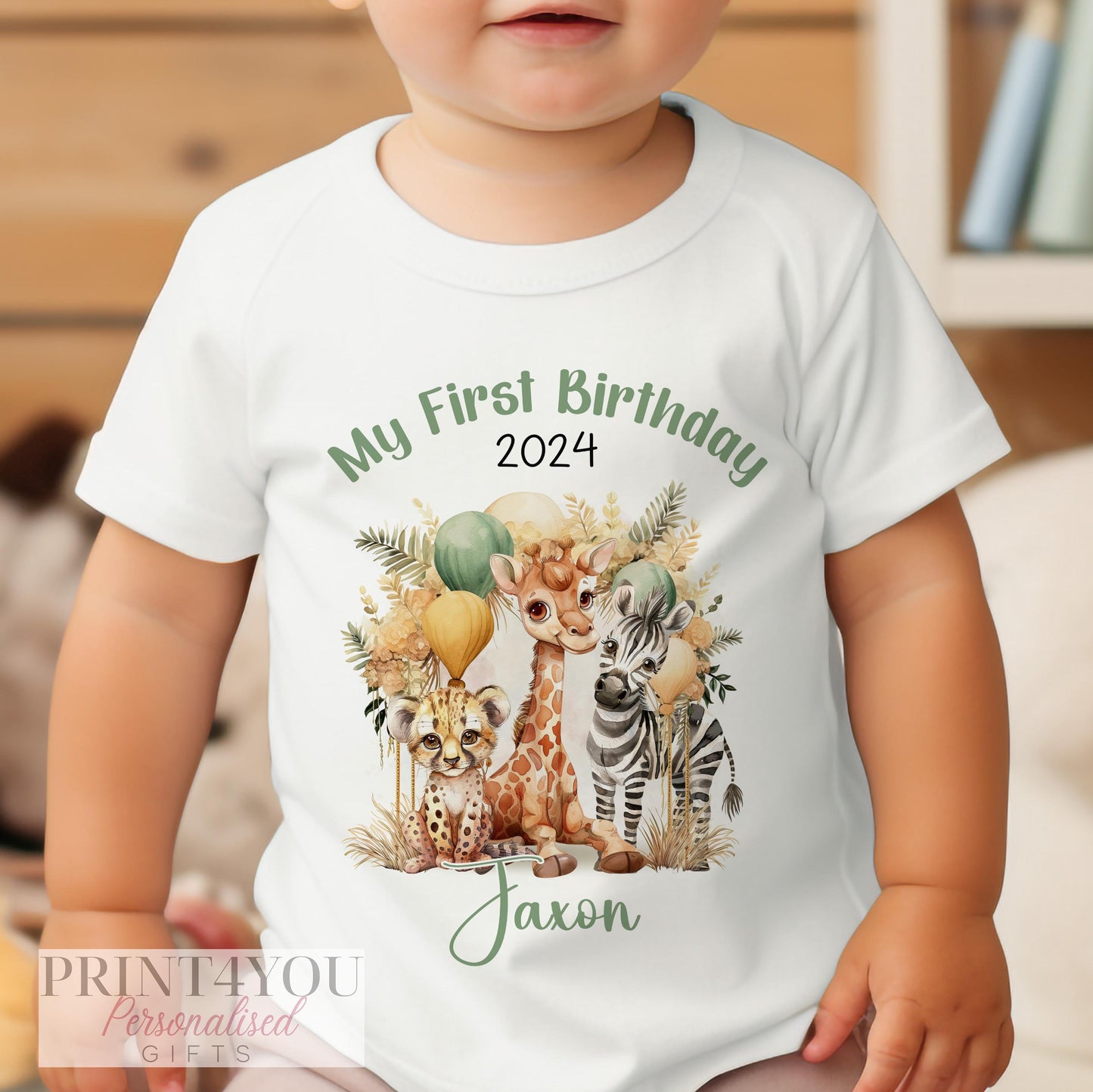 Personalised Boho Safari first birthday t-shirt laid flat showing the safari animal print and name.