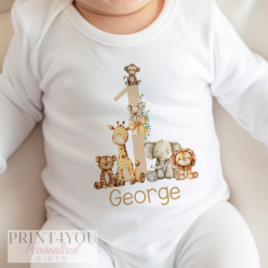 Personalised safari first birthday outfit, shown as a folded garment set with jungle animal print.