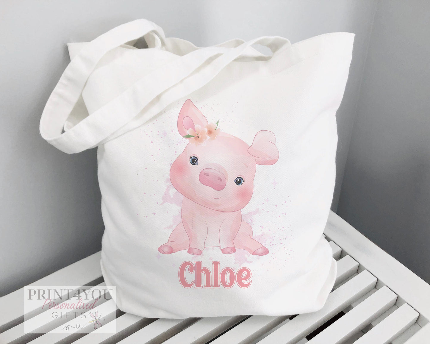 Personalised Highland Cow cotton tote bag with custom name print, shown with 67cm carry straps