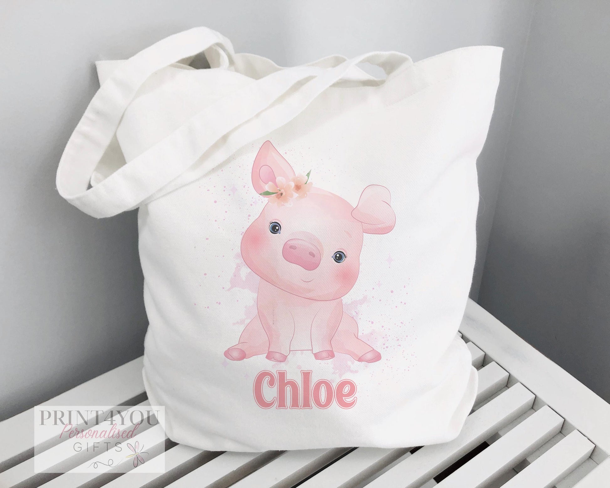 Personalised Highland Cow cotton tote bag with custom name print, shown with 67cm carry straps