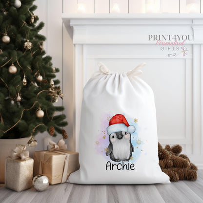 Cream canvas Santa sack personalised with a name, printed with an exclusive penguin wearing a Santa hat