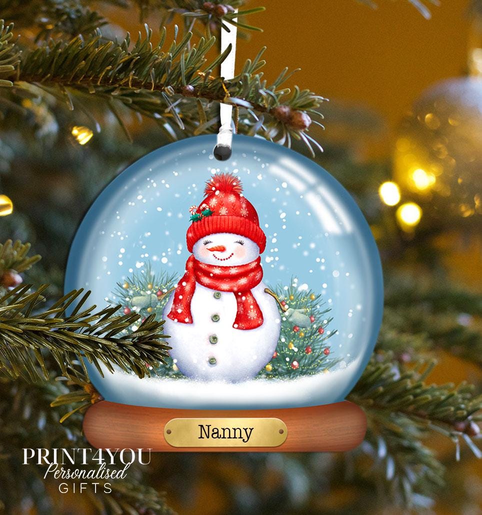 Personalised acrylic Christmas bauble featuring a Snowlady design, personalised with the name Ava