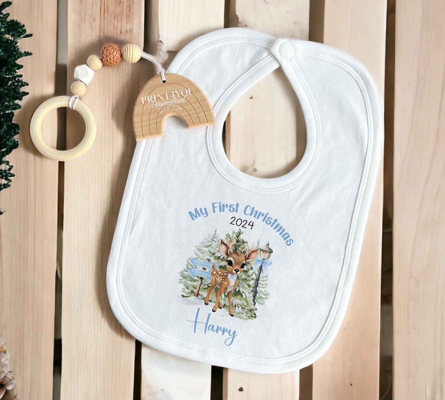 Personalised Blue Reindeer baby sleepsuit laid flat showing the festive print