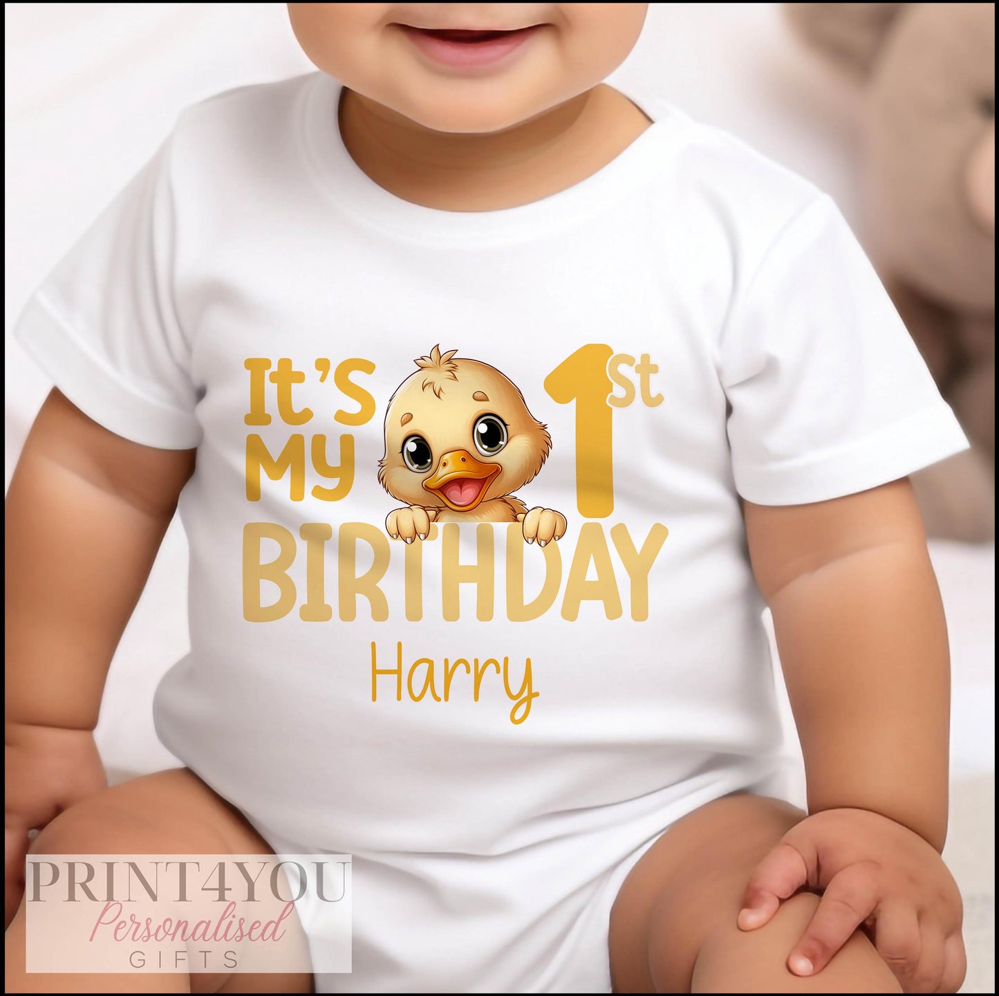 Close-up of the yellow duck artwork and personalised birthday number printed on the vest.