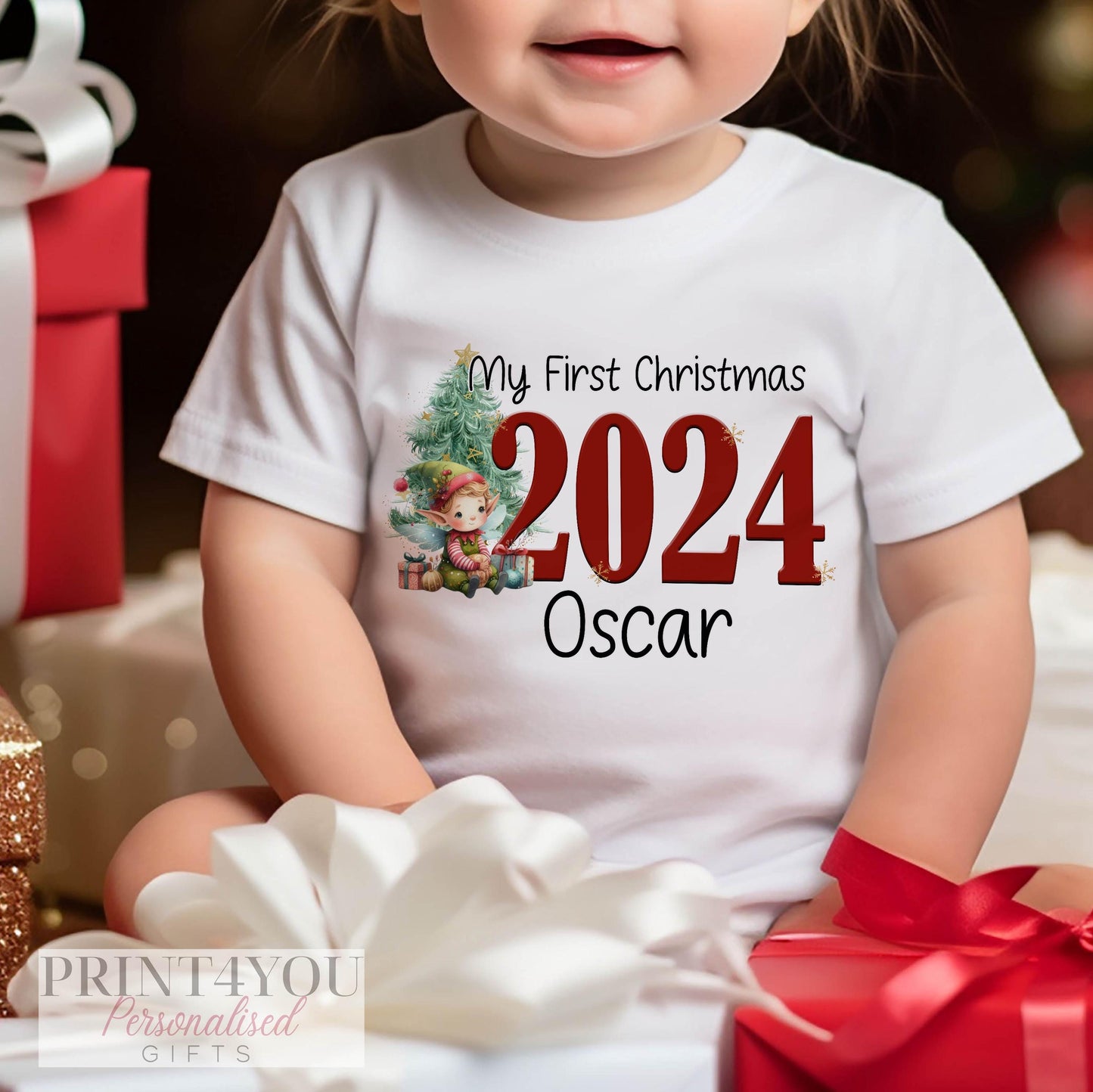 Personalised baby's first Christmas elf design bib in soft white cotton.