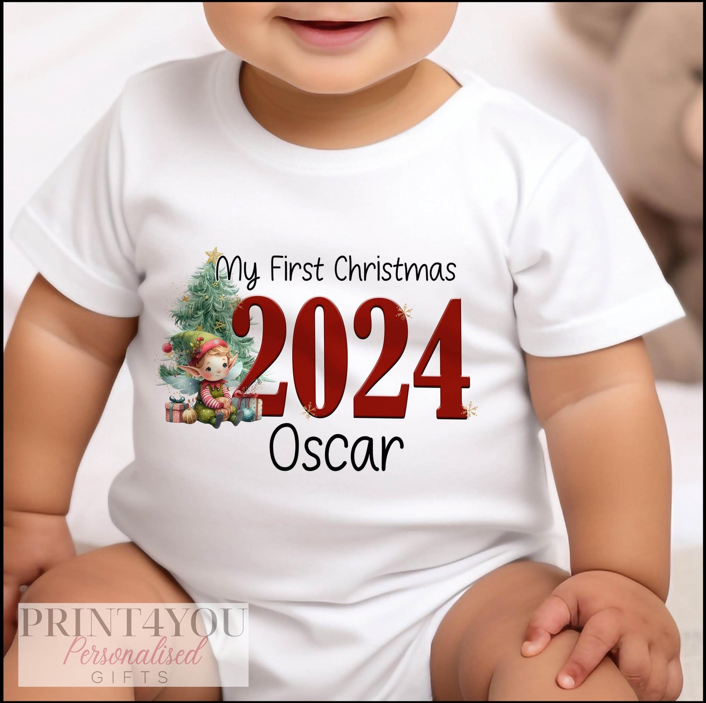 Personalised first Christmas elf design sleepsuit with popper fastenings.