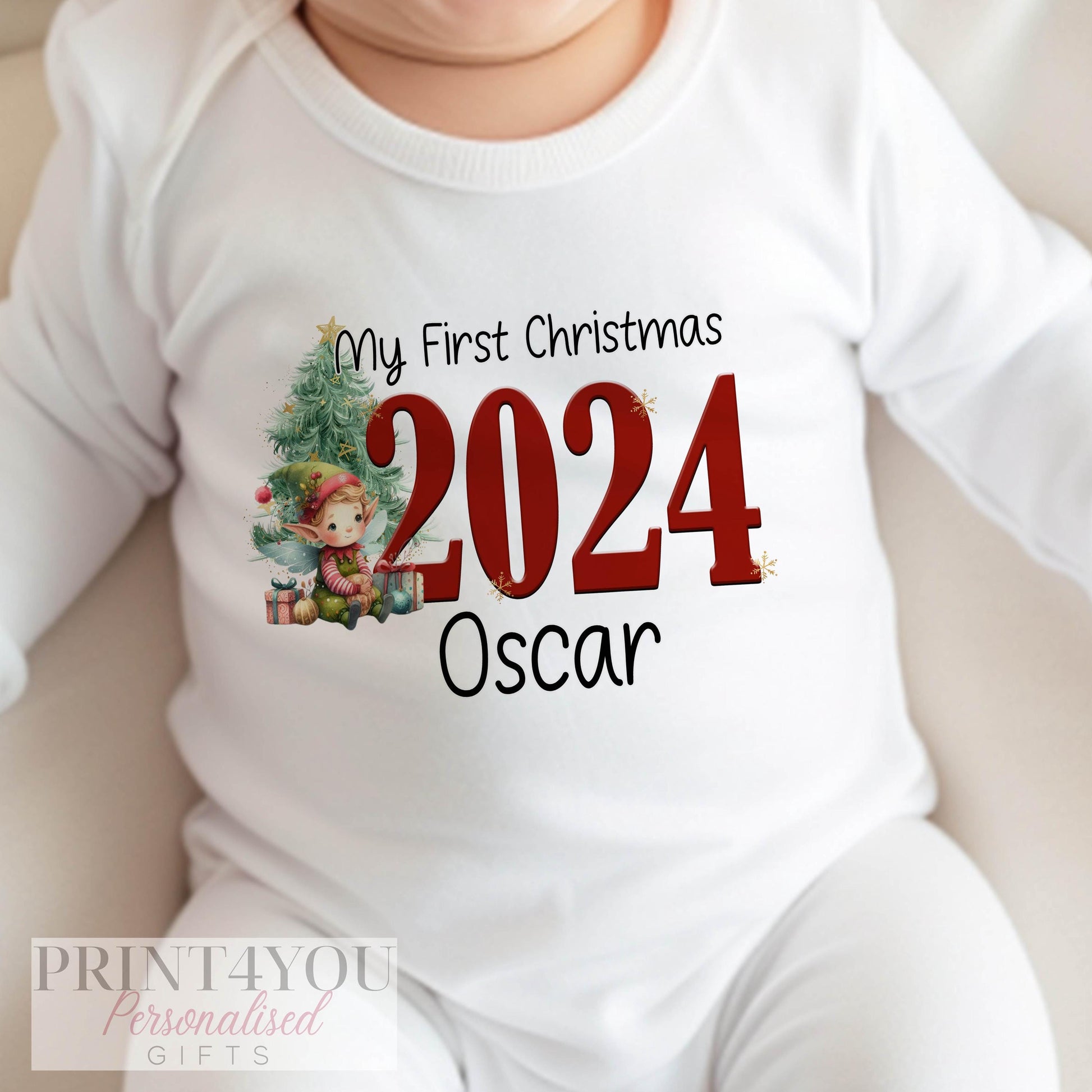 Personalised first Christmas elf design vest, printed with baby's name.
