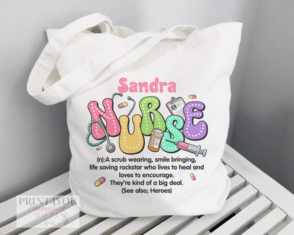 White cotton tote bag personalised with a nurse's name, printed with a Highland Cow illustration