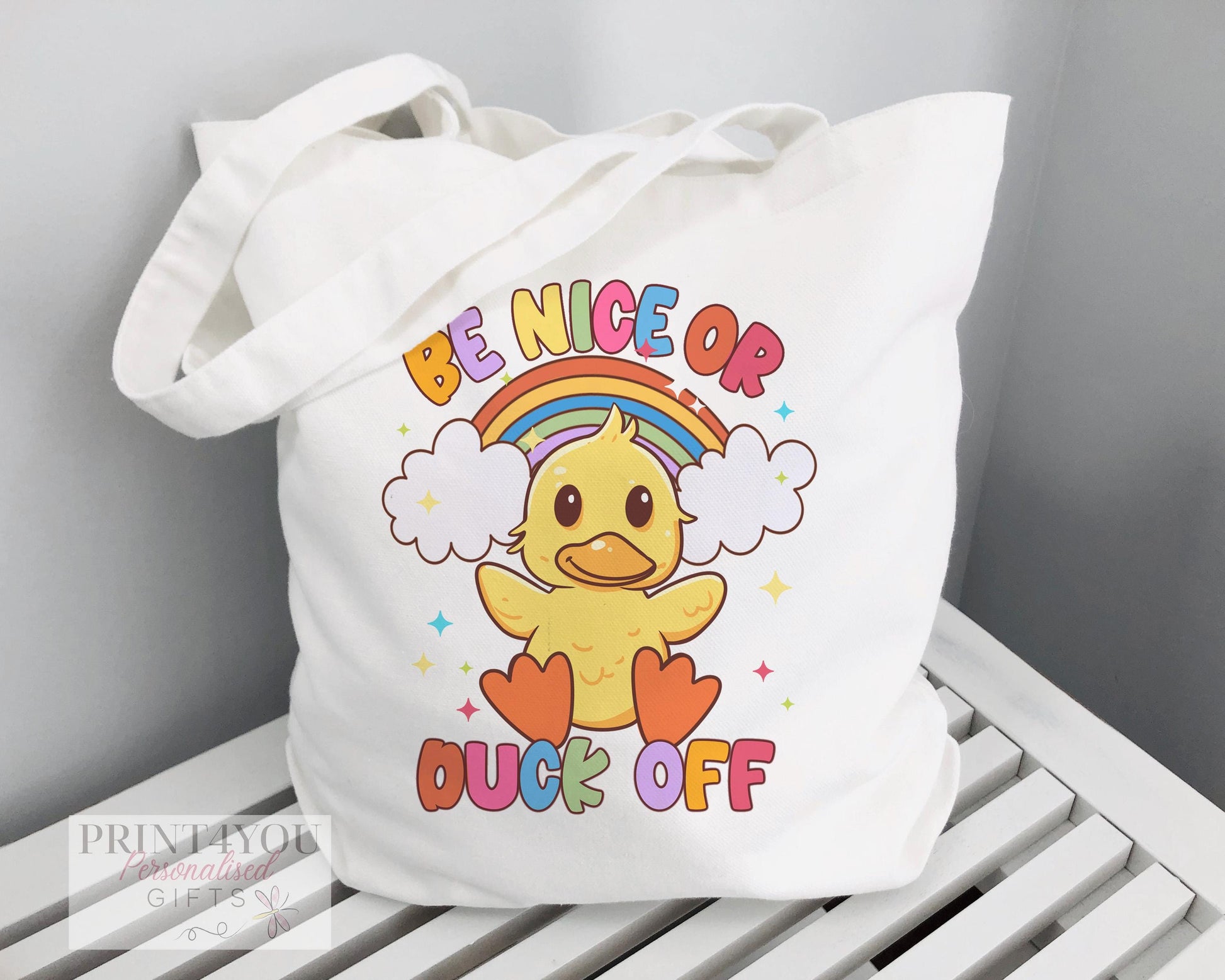 White cotton tote bag personalised with a name, printed with a durable Highland Cow design