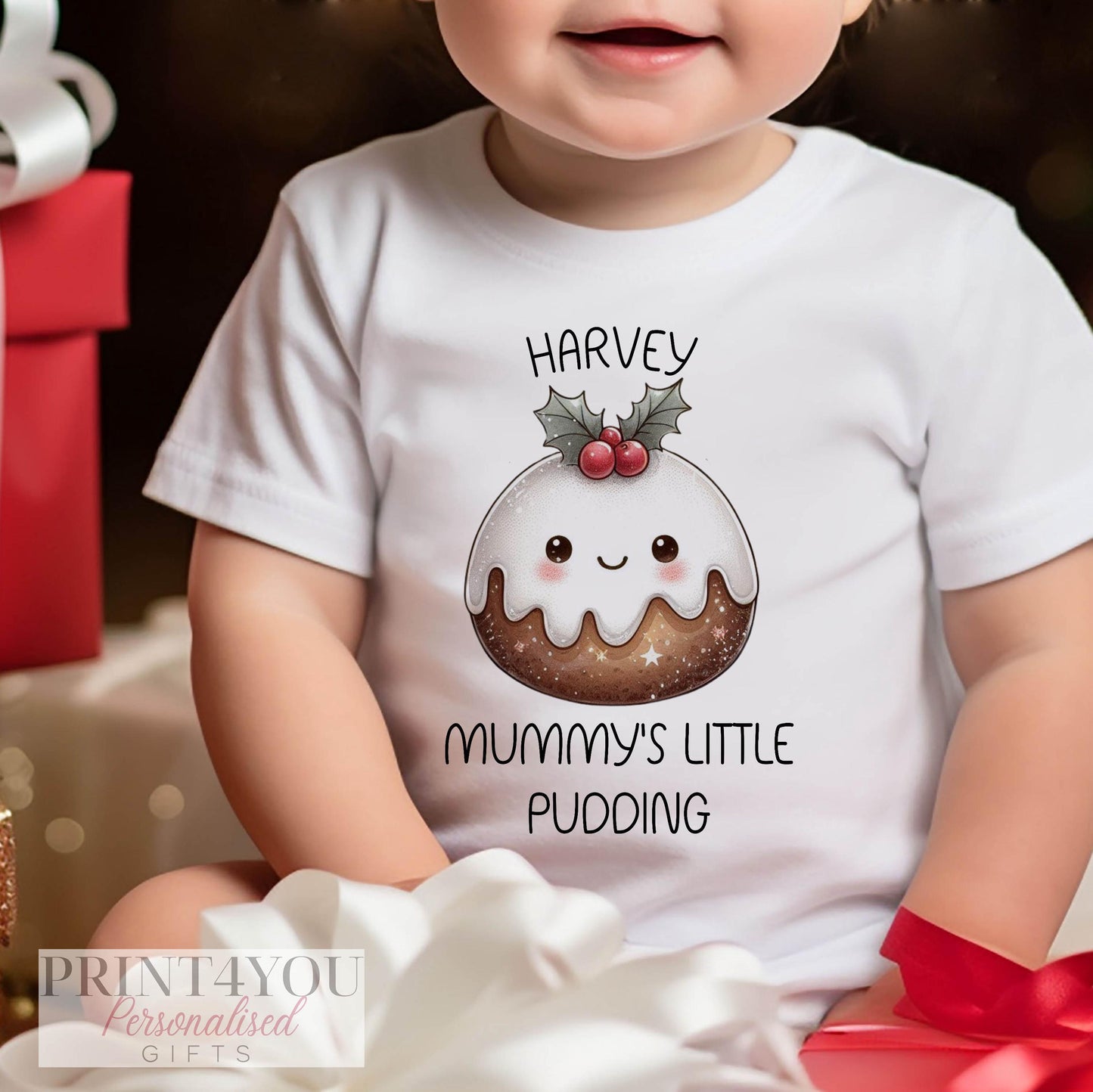 Baby's First Christmas personalised cotton gift set - flat lay of bib, vest and sleepsuit