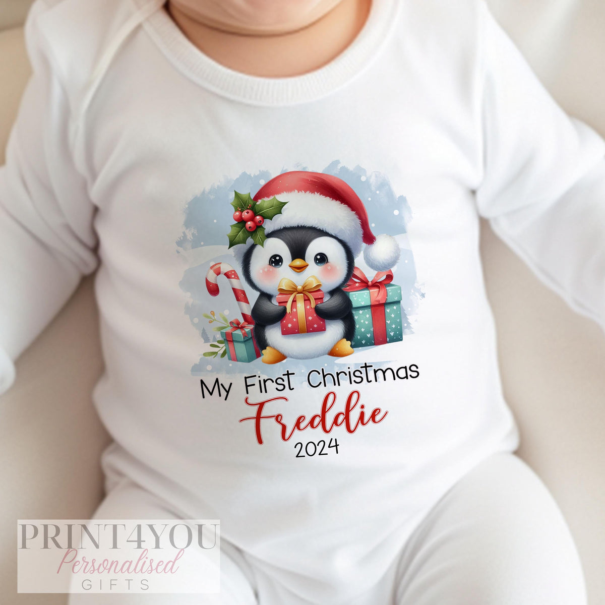 Personalised first Christmas penguin design T-shirt for baby.