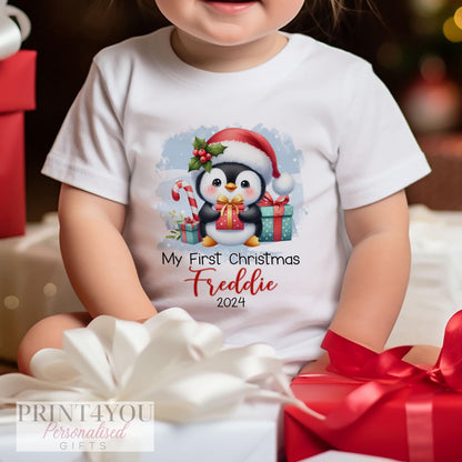 Personalised first Christmas penguin design sleepsuit with popper fastenings.