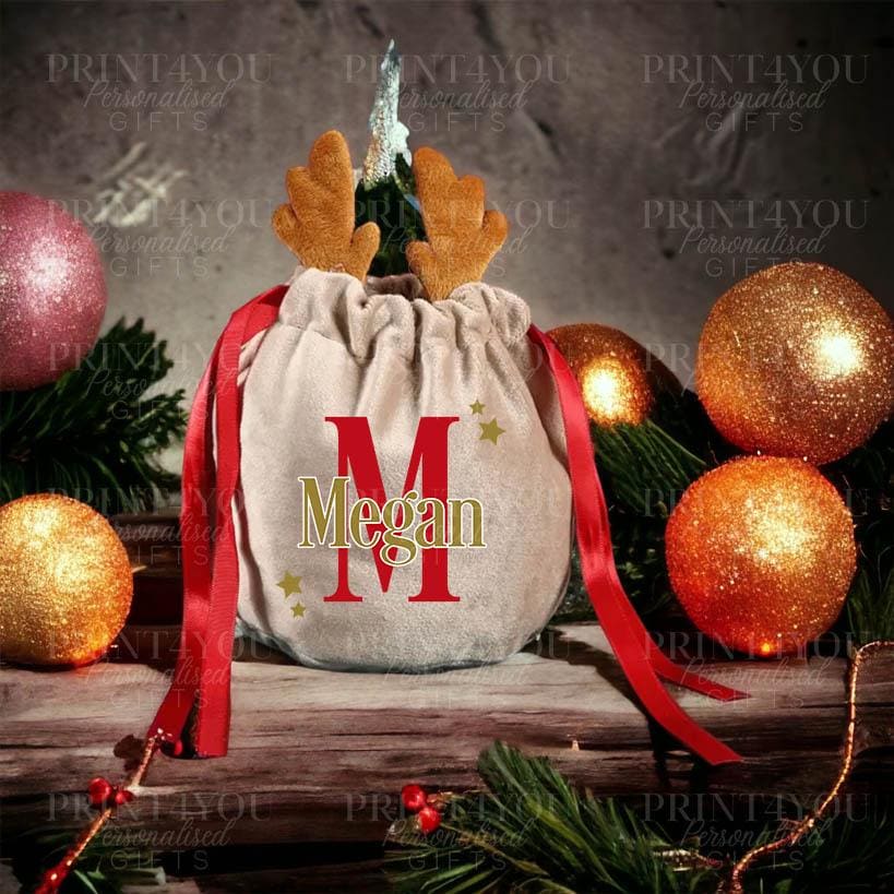 Personalised velvet reindeer gift bag with drawstring closure, approximately 13 x 15cm