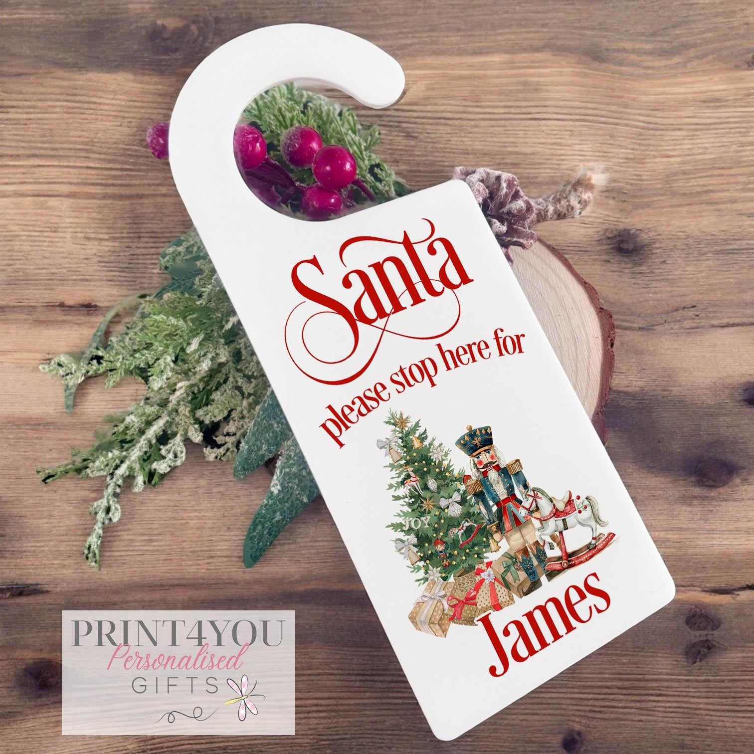 Personalised acrylic Santa Stop Here door hanger with nutcracker design and custom child's name